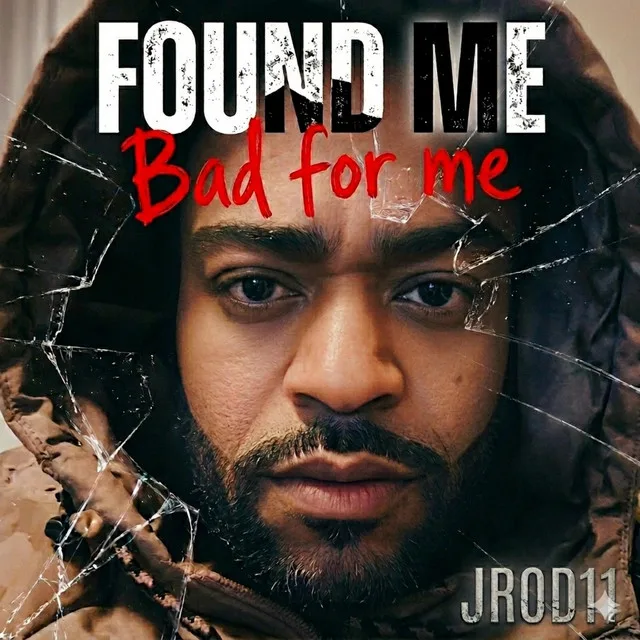 “Bad For Me” cover art — JC’s face seen through cracked glass: “Found me — bad for me”