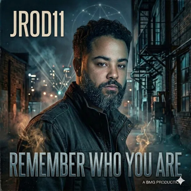 “Remember Who You Are” cover art — JC in a leather jacket on a rain-lit city street at night, smoke curling around him